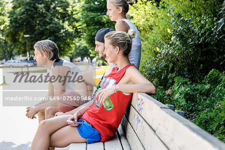 Group of basketball friends taking a break in park