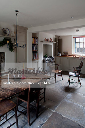 Basement kitchen with dining table and chairs, Whitechapel, London