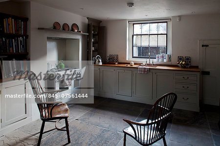 Period chairs in basement kitchen, Whitechapel, London