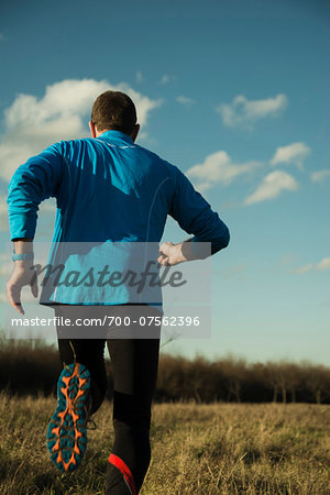 Back View of Mature Man Running Outdoors, Mannheim, Baden-Wurttemberg, Germany