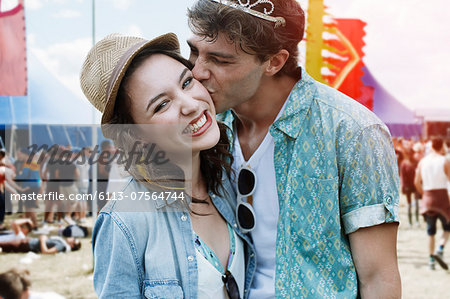 Couple kissing at music festival