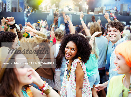 Fans dancing and cheering at music festival