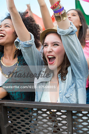 Woman cheering at music festival