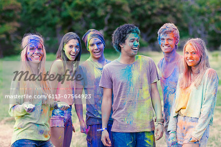 Portrait of friends covered in chalk dye