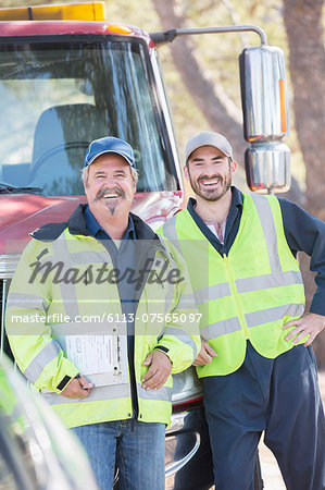 Portrait of confident roadside mechanics