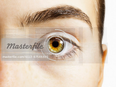 Extreme close up of retina scanner over hazel eye Extreme close up of retina scanner over hazel eye