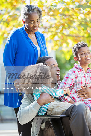 Happy grandparents and grandchildren outdoors