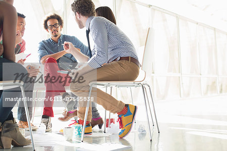 Creative business people meeting in circle of chairs Creative business people meeting in circle of chairs