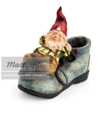 Gnome sitting on a boot isolated with clipping path