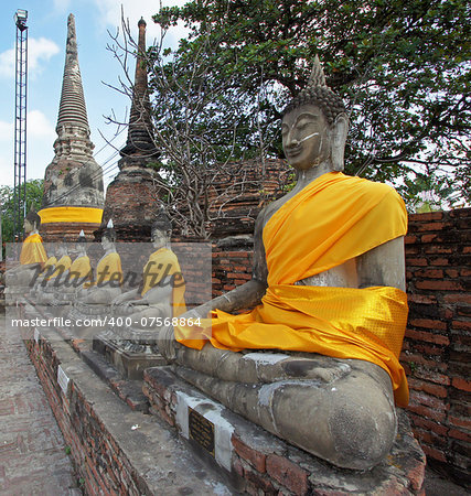 AYUTTHAYA, THAILAND - JANUARY 22, 2011: Buddha statues on temple Wat Yai Chai Mongkon on January 22, 2011 in Ayutthaya, Thailand, Asia