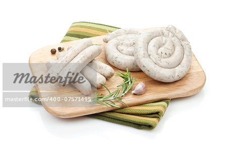 Raw sausages with spices. Isolated on white background
