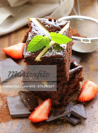 homemade chocolate cake (brownie) on a wooden board