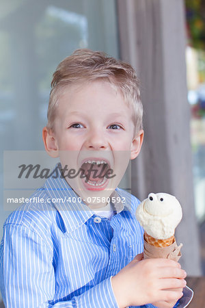 excited little boy eating ice-cream
