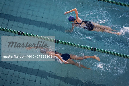 Female swimmers racing in the swimming pool at the leisure center