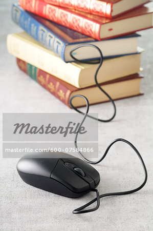 Computer Mouse and Stack of Books, Studio Shot