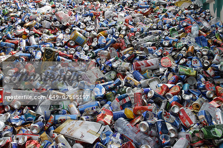 Pile of waste packaging, plastic bottles and tin cans