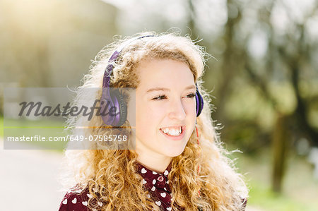 Portrait of teenage girl listening to headphones
