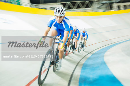 Track cyclist racing in velodrome