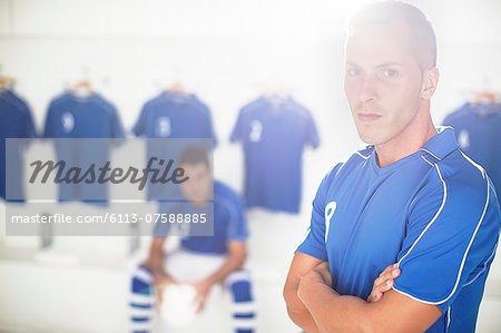 Soccer player standing in locker room