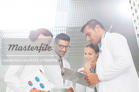 Doctors consulting in hospital Doctors consulting in hospital
