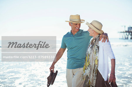 Senior couple walking on beach