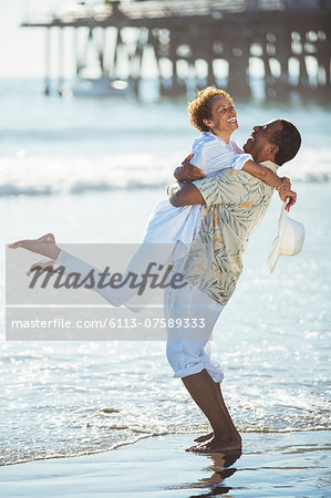 Couple hugging on beach