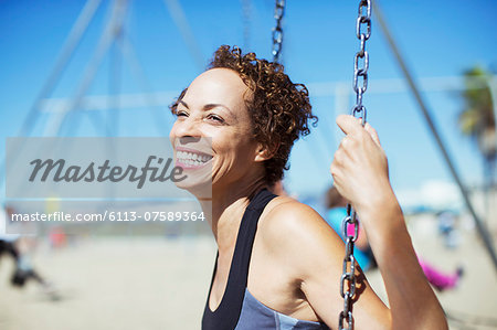 Enthusiastic woman swinging Enthusiastic woman swinging
