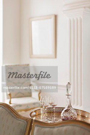 Crystal sherry decanter and cordial glasses in luxury living room