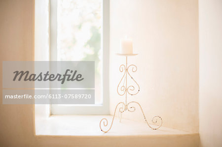 Scroll candleholder in sunny window