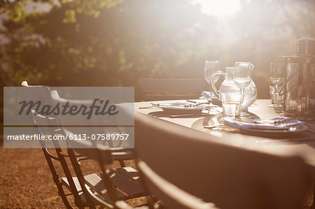 Place settings on sunny tranquil patio table