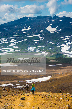 Tourists hiking to the smoking Gorely volcano, Kamchatka, Russia, Eurasia