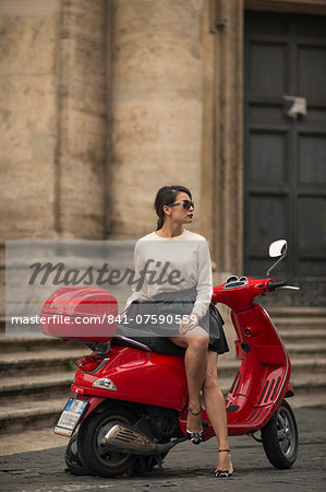 Young woman waiting by Vespa moped, Piazza del Popolo, Rome, Lazio, Italy, Europe Young woman waiting by Vespa moped, Piazza del Popolo, Rome, Lazio, Italy, Europe