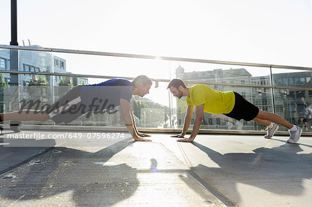 Runners doing push ups, Munich, Germany