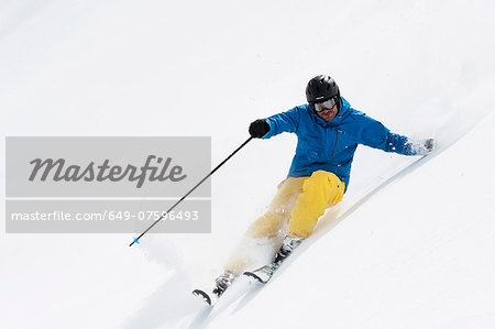 Mid adult man skiing downhill, Obergurgl, Austria