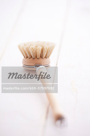 A wooden washing-up brush