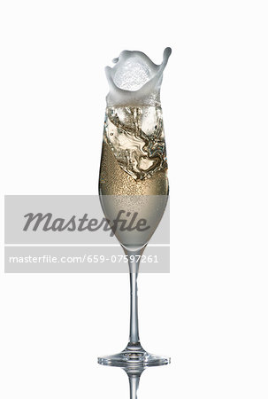Champagne splashing out of a glass