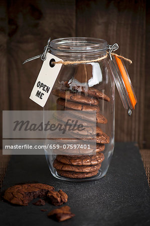 dark chocolate cookies in the jar with the label