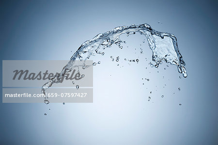 A splash of water against a grey background A splash of water against a grey background