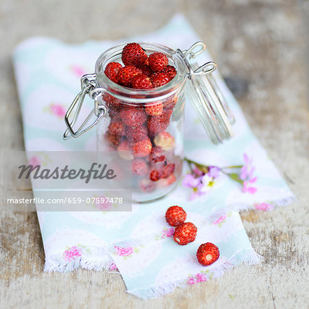 Wild strawberries in a preserving jar