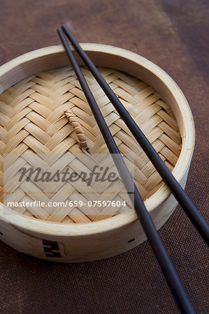 Bamboo steamer with chopsticks