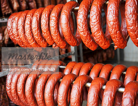 Sausages hanging in a smokehouse
