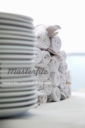 White plates and napkins, stacked White plates and napkins, stacked