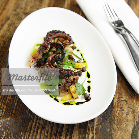 Grilled Octopus with Pickled Eggplant, Fingerling Potatoes, Herb Salad and Red Pearl Onions