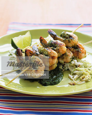 A prawn skewer with a lime & mint sauce