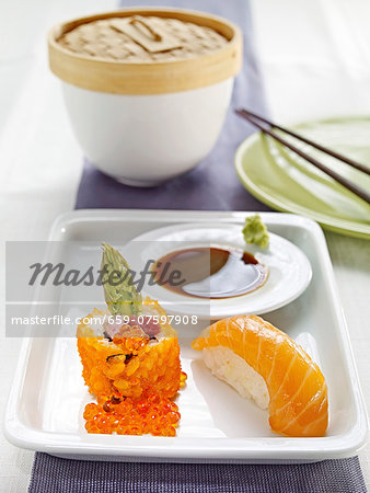 Nigiri sushi with salmon and maki with asparagus and caviar Nigiri sushi with salmon and maki with asparagus and caviar