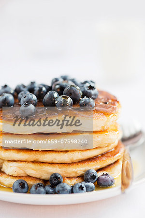 Pancakes with blueberries and honey