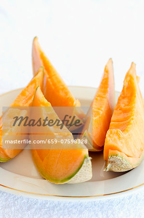 Slices of Cavaillon melon on a plate