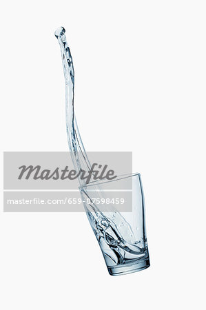 A water glass with a splash