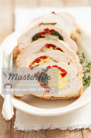Turkey breast stuffed with egg, spinach and red peppers