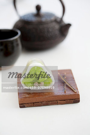 Wagashi pine (watsu) with a pot of tea (Japan)